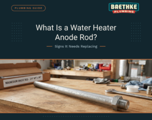 Water heater anode rod replacement guide banner by Baethke Plumbing showing a new magnesium anode rod on a workbench.