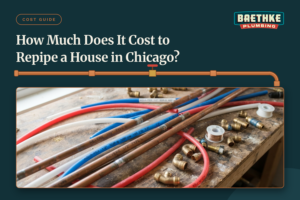 How much does it cost to repipe a house in Chicago? Copper pipes, PEX tubing, and brass fittings laid out on a plumber's workbench.